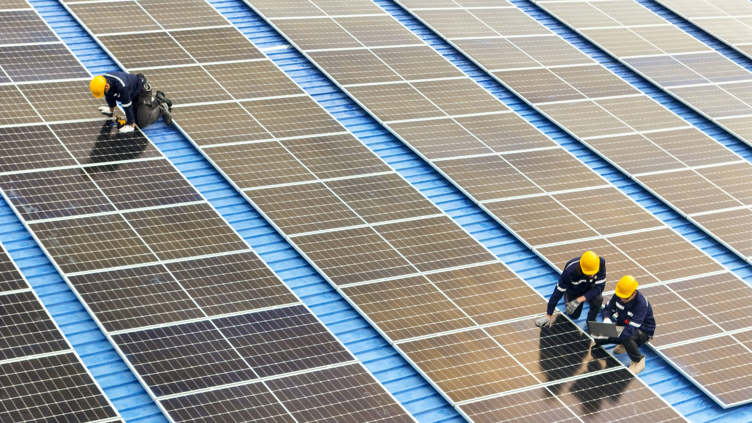 Solar panel installation team working on an array