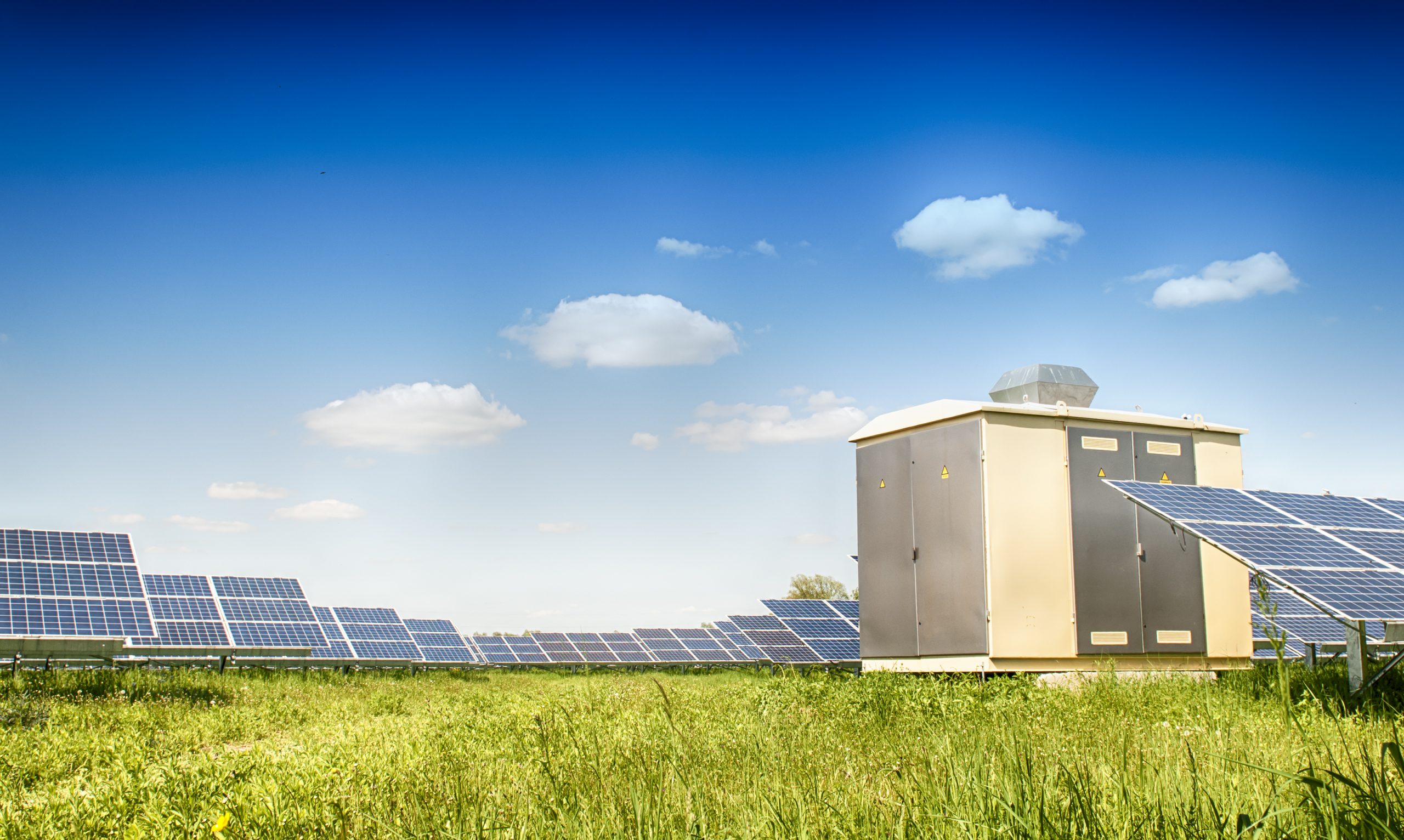 Large solar power plant on open green fields