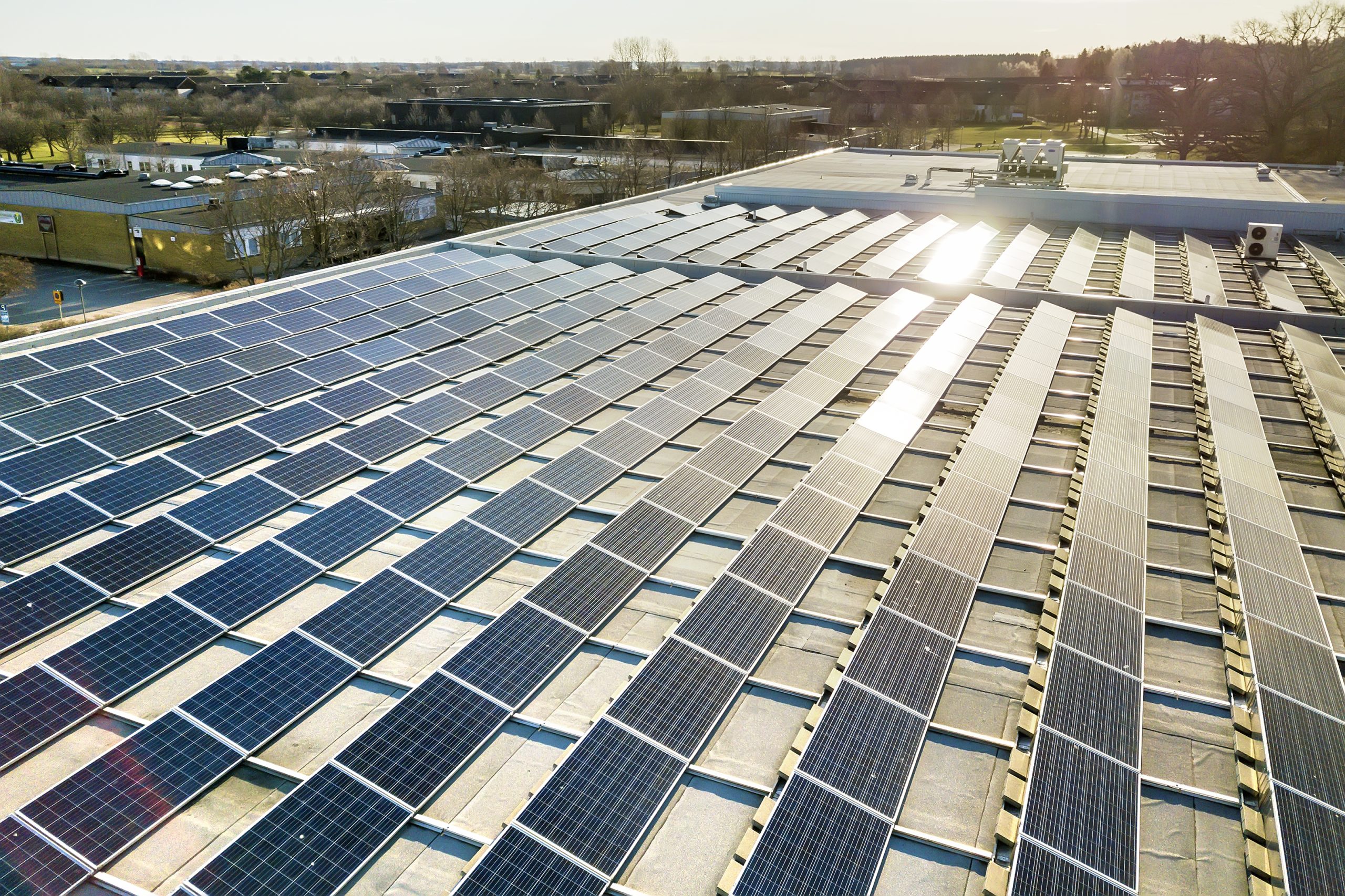 Top-down view of blue commercial solar PV panels